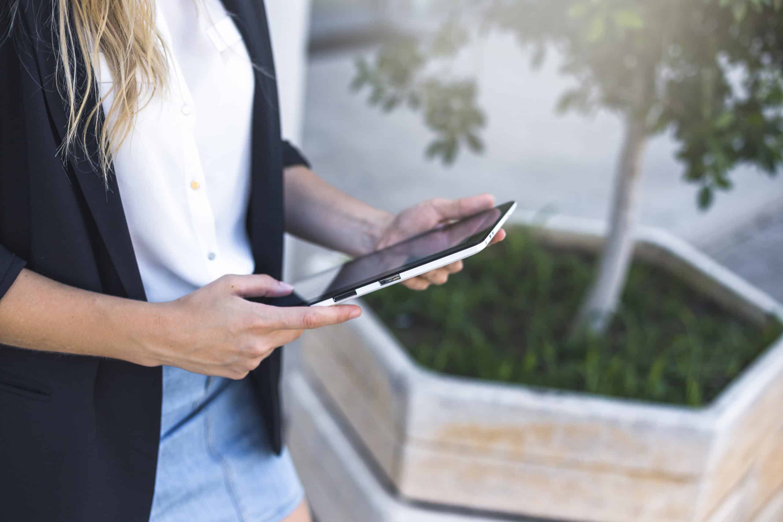 overhead-view-woman-holding-digital-tablet-scaled